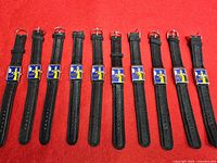 Ten wristwatches laid out showing straps and faces