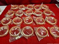 All 20 bangles laid out, most in original plastic bags