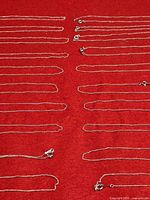 Rows of chains highlighting link styles and silver-tone finish