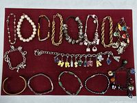 Overall view of all bracelets laid on red board