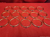 All fifteen bangles arranged in rows showing overall quantity and uniform design.