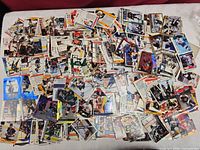 Wide view of entire spread of hockey cards on table
