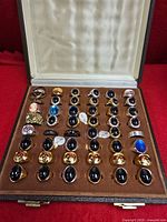 full view of open display case showing entire ring collection