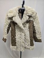 Full front view of suede coat with fur lining