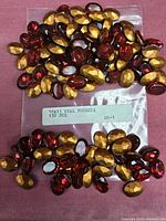 Bag and loose oval rhinestones showing quantity and color