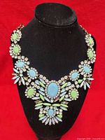 Full view of necklace on display bust showing overall design