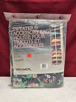 Front of sealed Whitmor hanging organizer package