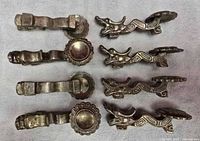 Top view of dragon chopstick rests showing dragon heads and circular pads