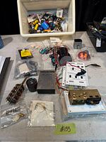 Overview of tub with assorted electronic parts, crossover, pre-amp panel and switches