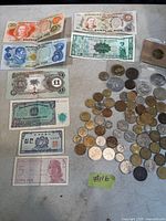 Overall view showing all coins and eight banknotes