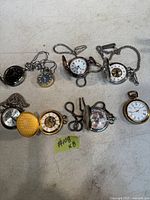 All eight pocket watches laid out for overview
