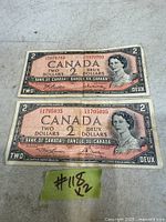 Front of both $2 bills showing obverse design and serial numbers