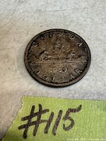 Reverse of 1959 Canadian silver dollar showing canoe scene