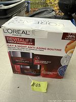 Front of sealed L'Oreal Revitalift Triple Power LZR Day & Night Routine box