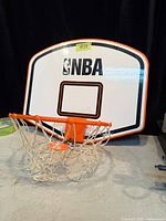 Front view of NBA mini backboard with rim and net