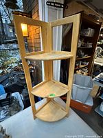 corner shelf open showing three shelves