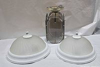 Two flush-mount lights and one lantern light grouped