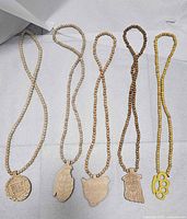 All five wood bead necklaces laid out