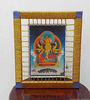 Front view of framed leather artwork showing entire piece