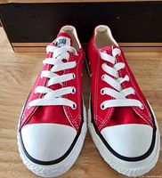 Front view of red Converse kids sneakers