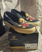 Shoes on box showing graphic and size label