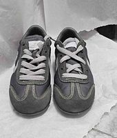 Top view of both shoes showing laces, stitching and condition