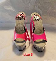 Front view showing pink patent uppers and size indication