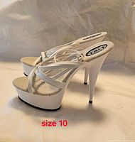 side view of pair showing straps, heel height and size note