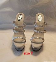 Front view of the pair showing clear straps and size labeling