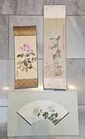 Overview of three Chinese paintings: two scrolls and one fan-shaped work