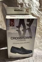 Front of Biotime Crosstown overshoes box showing model and image of overshoe