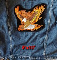 Front view of the embroidered bald eagle flame patch positioned on a denim jacket with size text 8"x10"