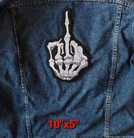 Patch displayed on denim jacket, size reference text 10"x5" visible.