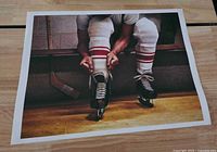 Hockey player poster on wood surface