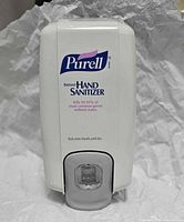 Front view of Purell push dispenser