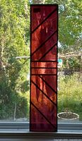 Vertical view of full stained glass panel showing color and pattern