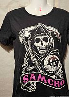 Front view of black SAMCRO graphic T-shirt on mannequin