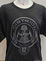 Front view showing District 12 graphic and shirt color