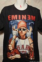 Front view of black Eminem graphic T-shirt showing size large