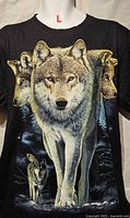 Front view of the black T-shirt with wolf graphic