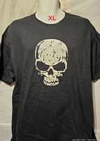 Front view of black T-shirt showing skull graphic