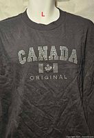 Front view showing full T-shirt with rhinestone design and size indicator