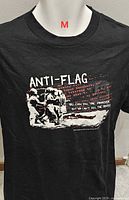 Front view of black Anti-Flag T-shirt with graphic