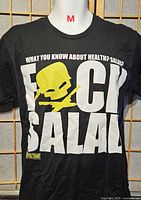 Front view of black graphic T-shirt showing full design and size indicator