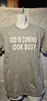 Front view of gray men’s medium T-shirt showing white text graphic