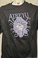 Front view of black Atreyu graphic T-shirt displaying design and size label M
