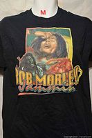 Front view showing full Bob Marley graphic and size tag indicator
