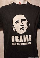 Front of black graphic T-shirt showing design and condition