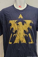 Front view showing yellow graphic and overall shirt condition