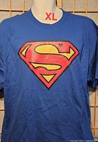 Front view showing Superman emblem and size XL label